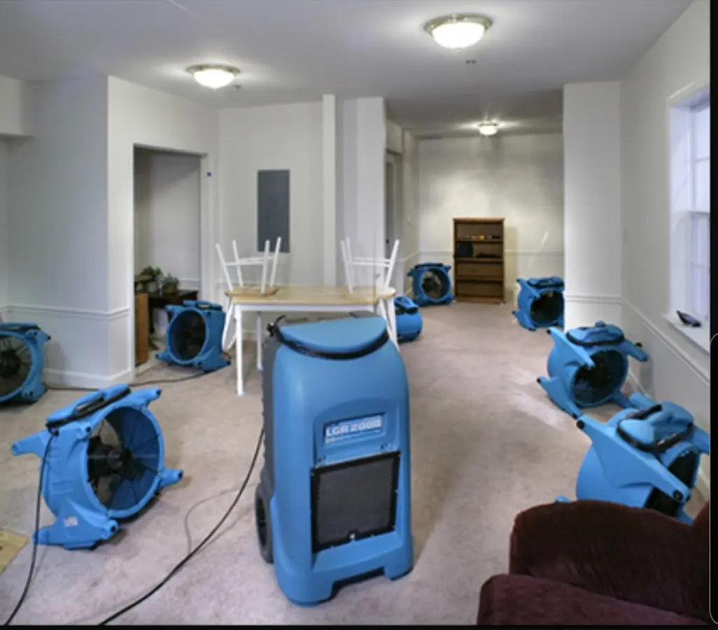 Air movers and dehumidifier setup for Water Damage Restoration in Polk